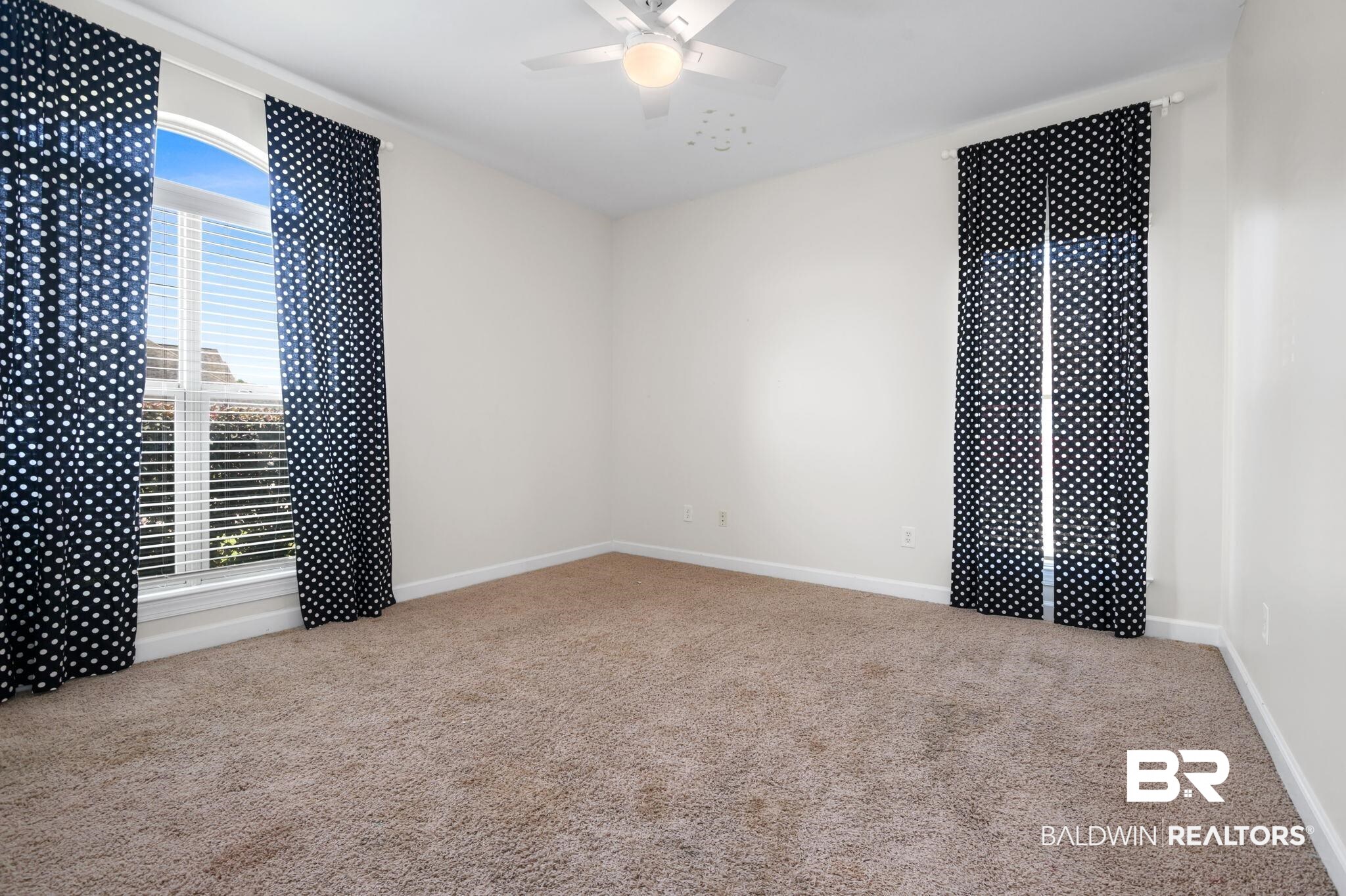 9730 Harmony Ridge Circle West Semmes, AL 36575 - Photo 24 of 38 Empty room featuring carpet floors, a ceiling fan, and baseboards