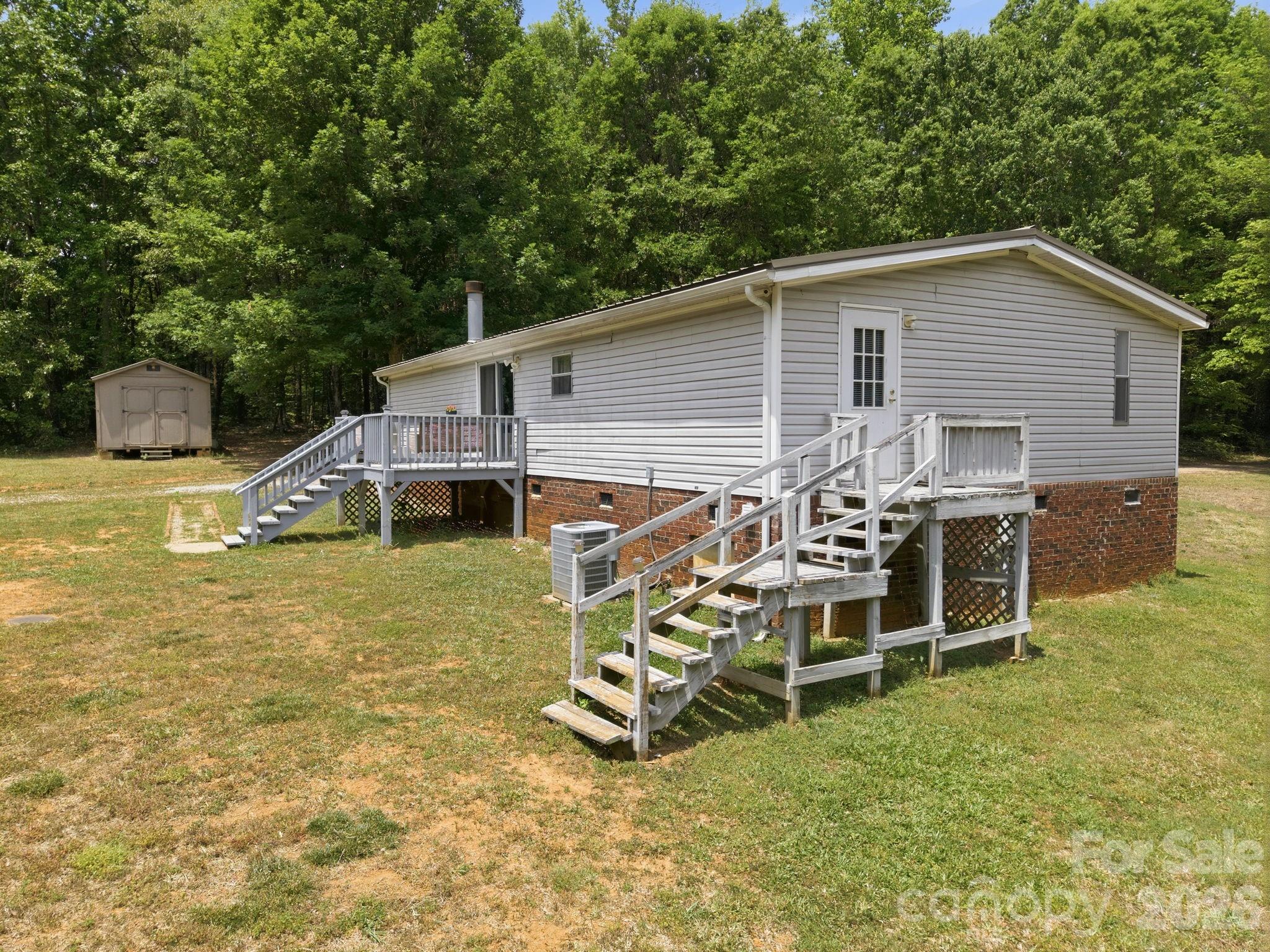 675 Overcash Road Salisbury, NC 28147 - Photo 35 of 48 a view of a house with a yard and sitting area
