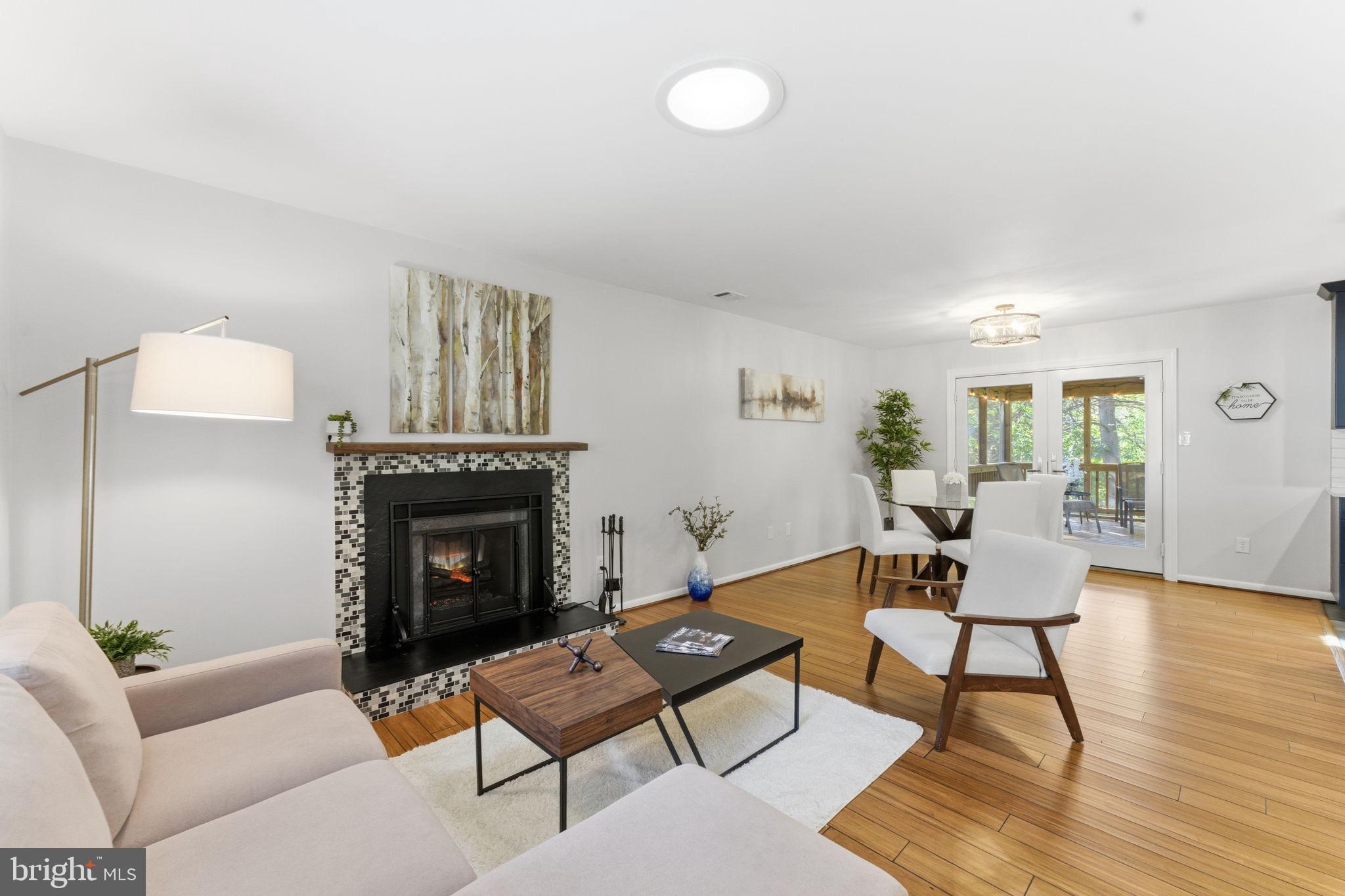 11309 Gatesborough Lane Reston, VA 20191 - Photo 11 of 85 a living room with furniture and a fireplace