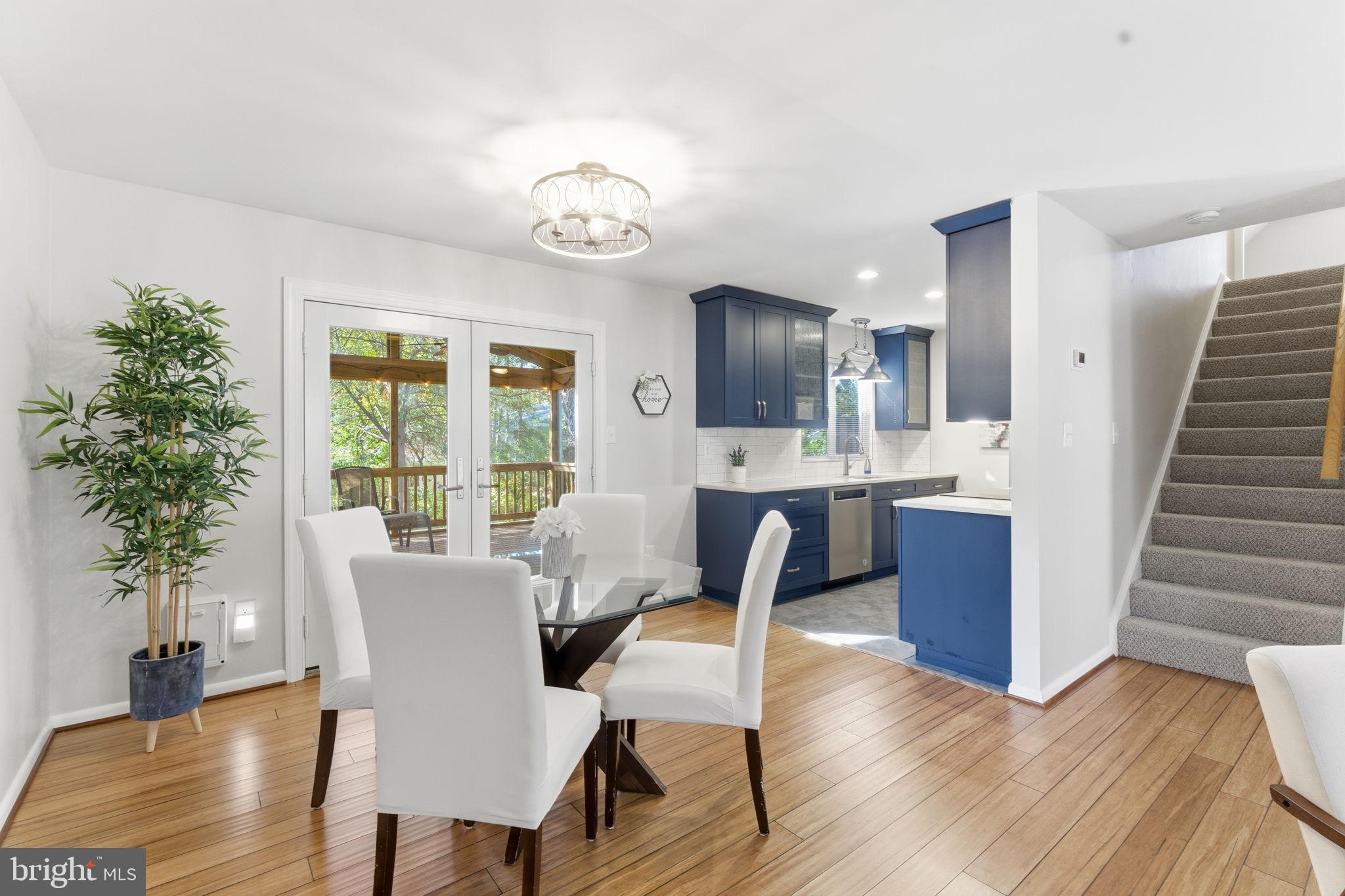 11309 Gatesborough Lane Reston, VA 20191 - Photo 12 of 85 a view of a dining room with furniture window and wooden floor