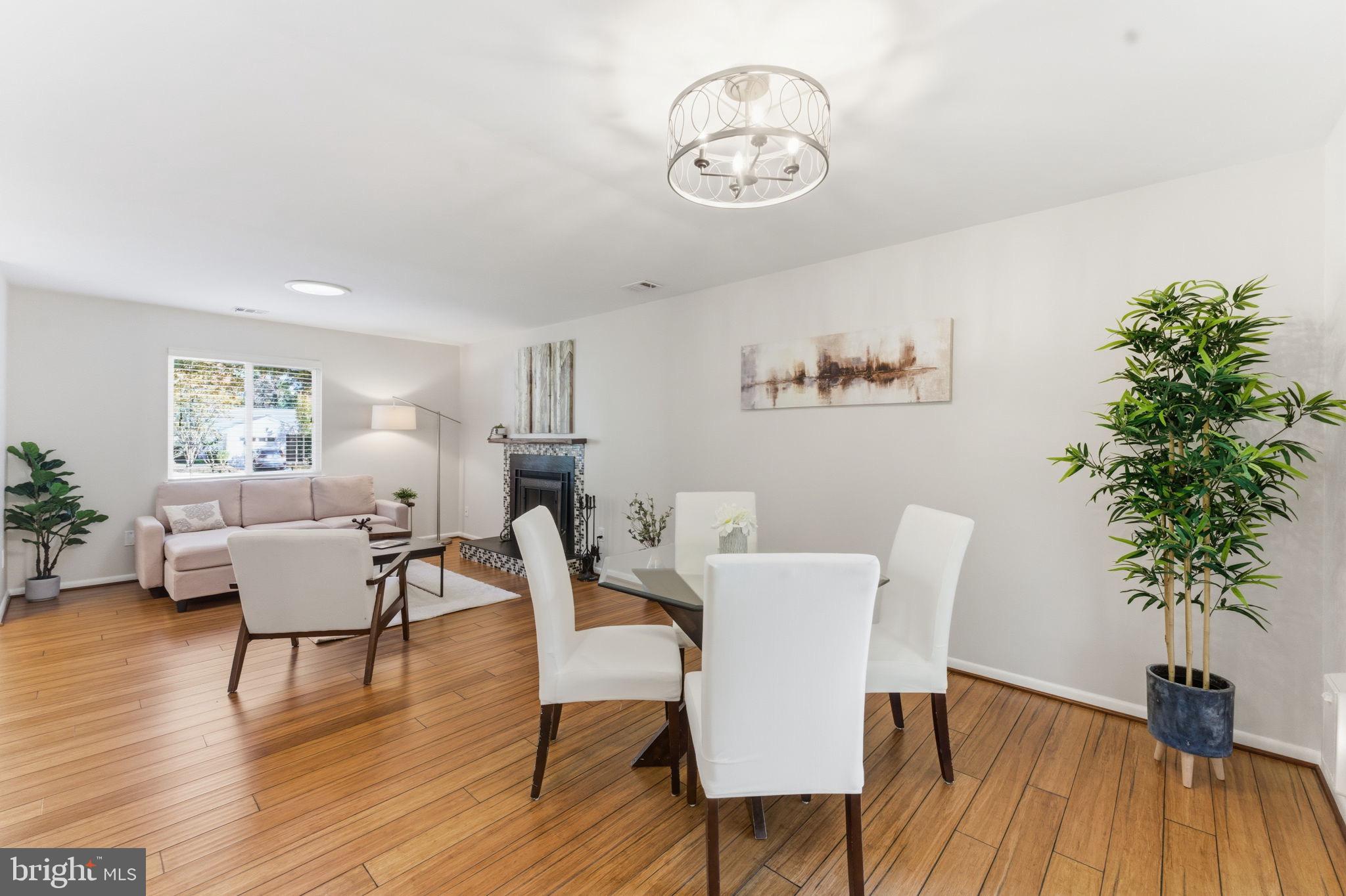 11309 Gatesborough Lane Reston, VA 20191 - Photo 13 of 85 a view of a dining room with furniture and wooden floor