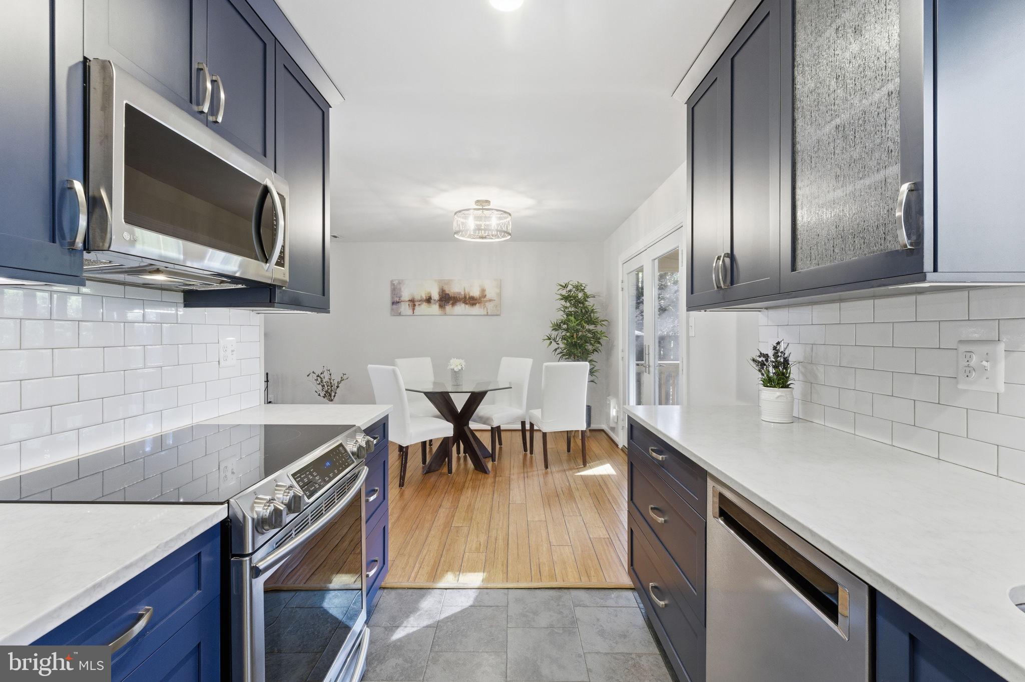 11309 Gatesborough Lane Reston, VA 20191 - Photo 18 of 85 Modern kitchen with sleek design elements.