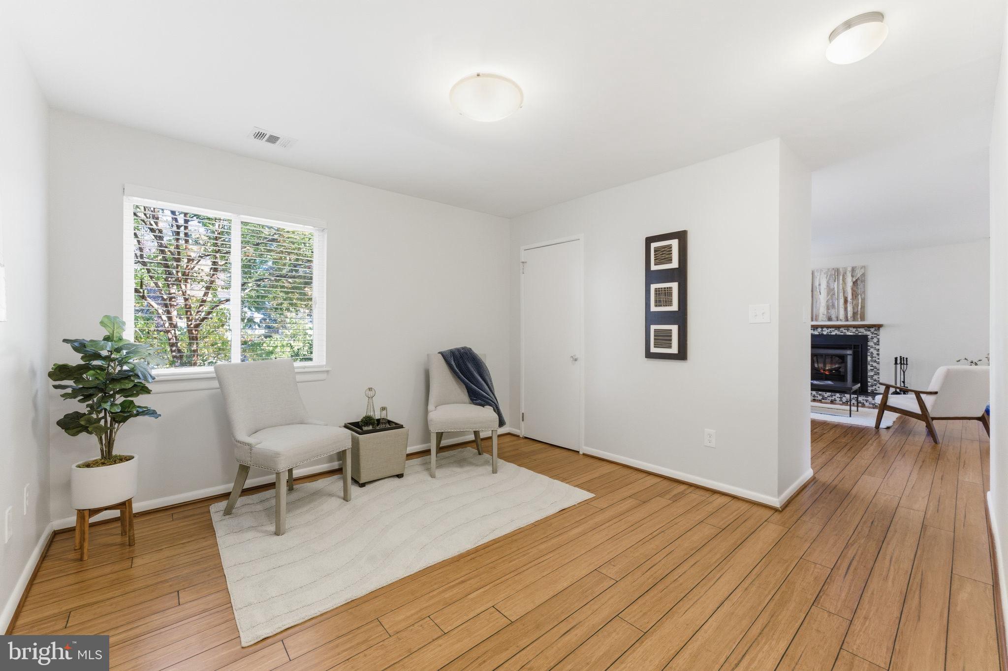 11309 Gatesborough Lane Reston, VA 20191 - Photo 24 of 85 a living room with furniture and a potted plant