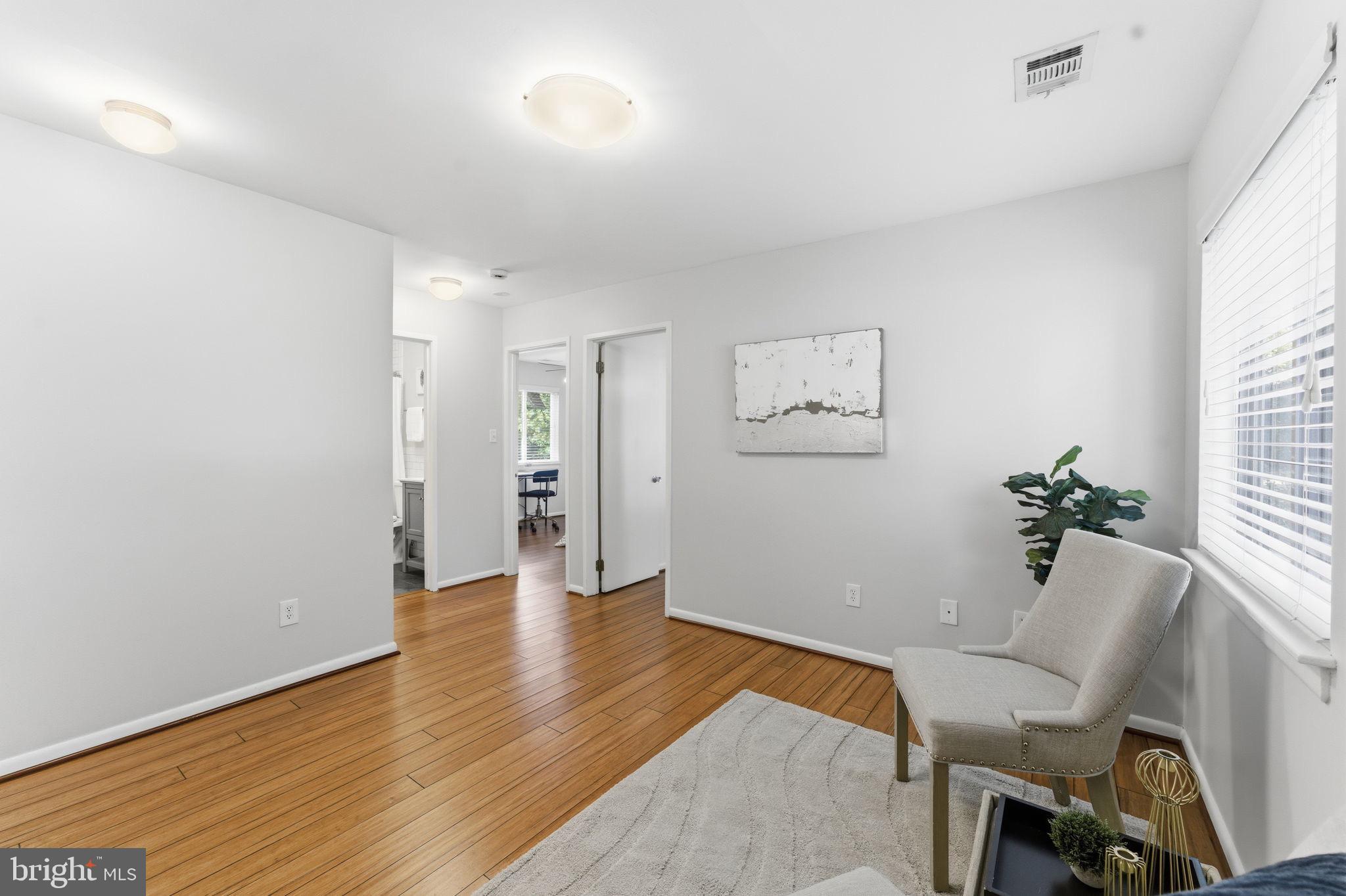 11309 Gatesborough Lane Reston, VA 20191 - Photo 27 of 85 a view of an empty room with wooden floor and a window