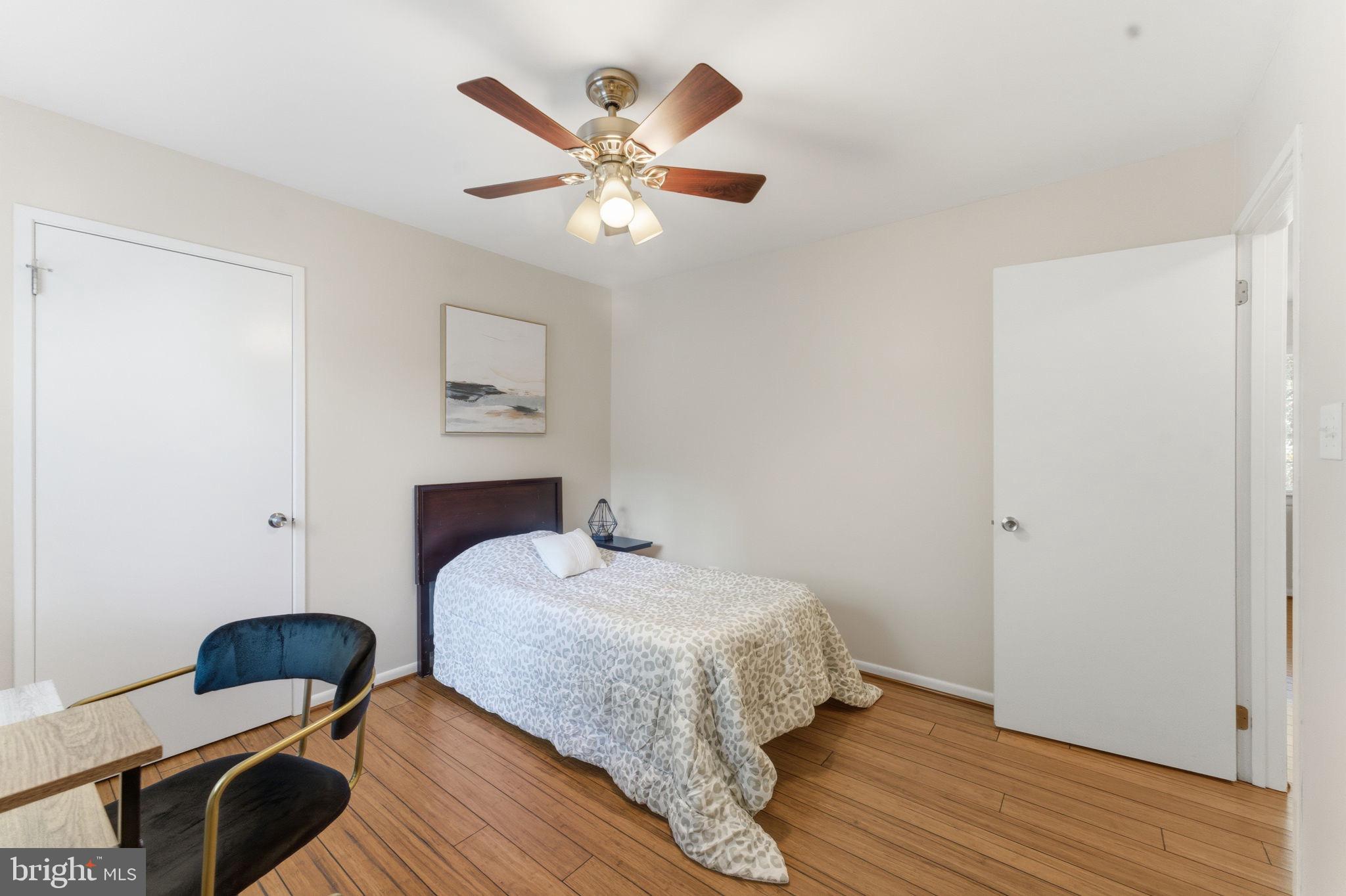 11309 Gatesborough Lane Reston, VA 20191 - Photo 30 of 85 a bedroom with a bed and wooden floor