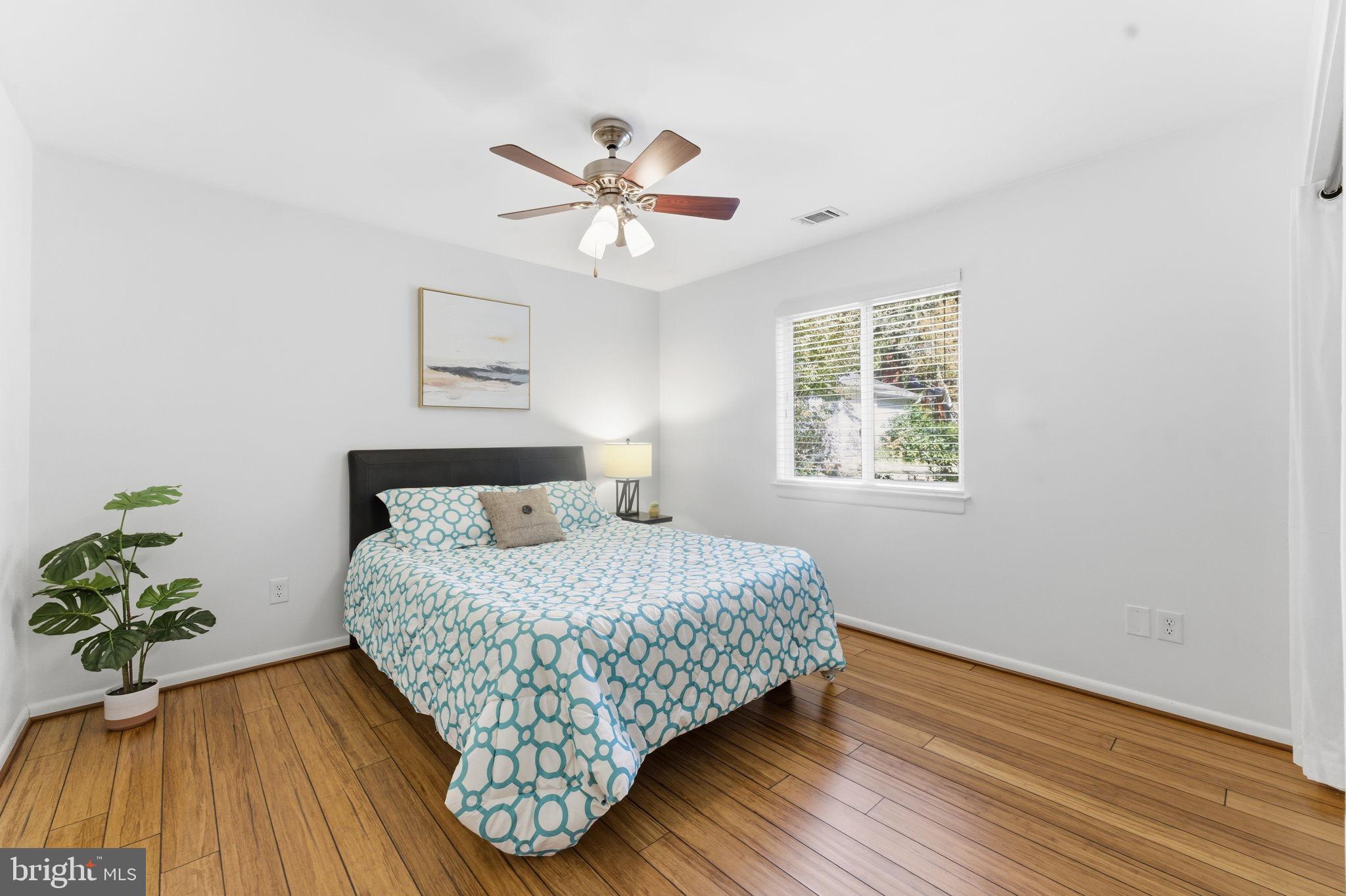 11309 Gatesborough Lane Reston, VA 20191 - Photo 32 of 85 a bedroom with a bed and wooden floor