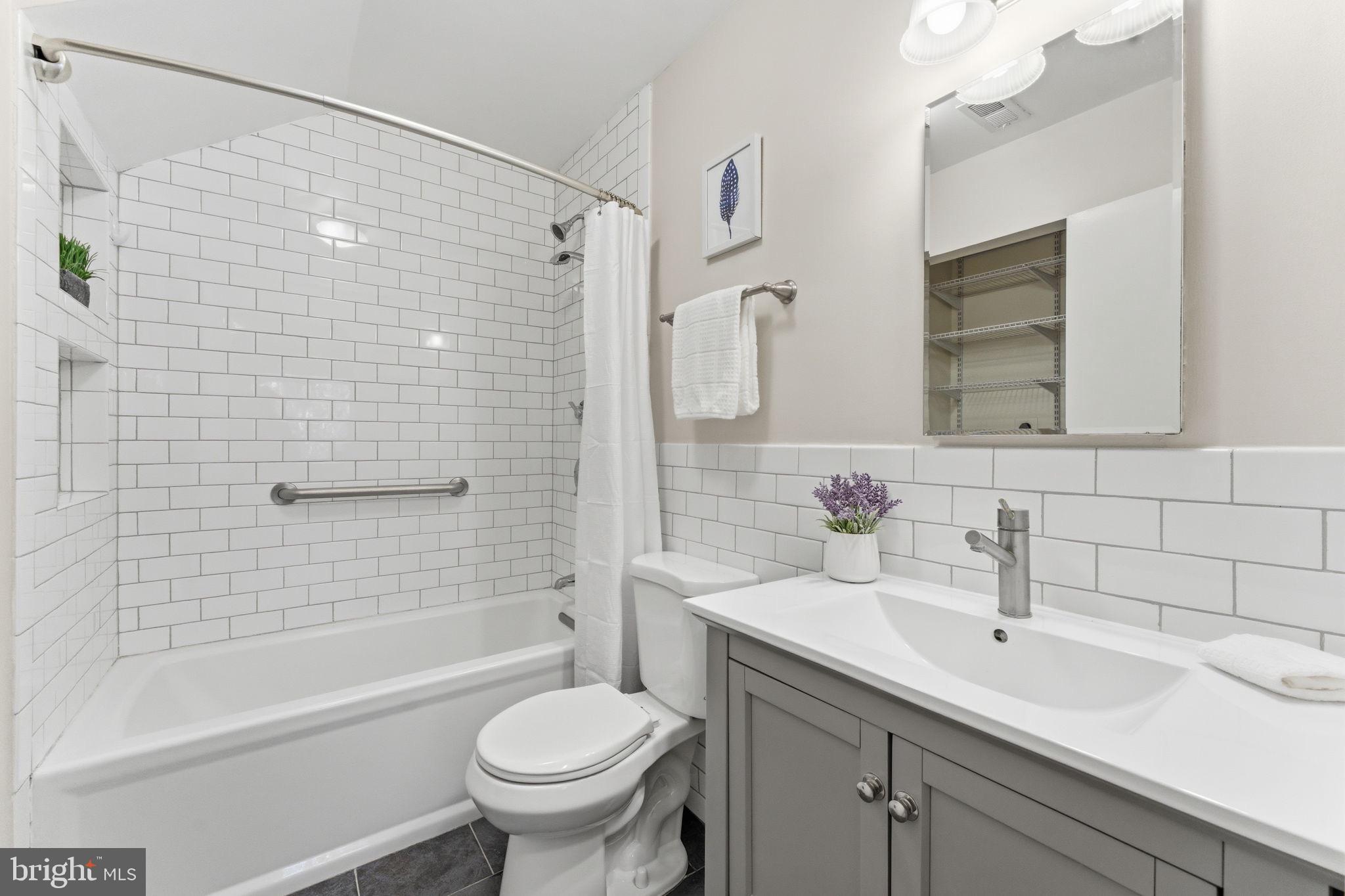11309 Gatesborough Lane Reston, VA 20191 - Photo 35 of 85 a bathroom with a sink toilet and shower