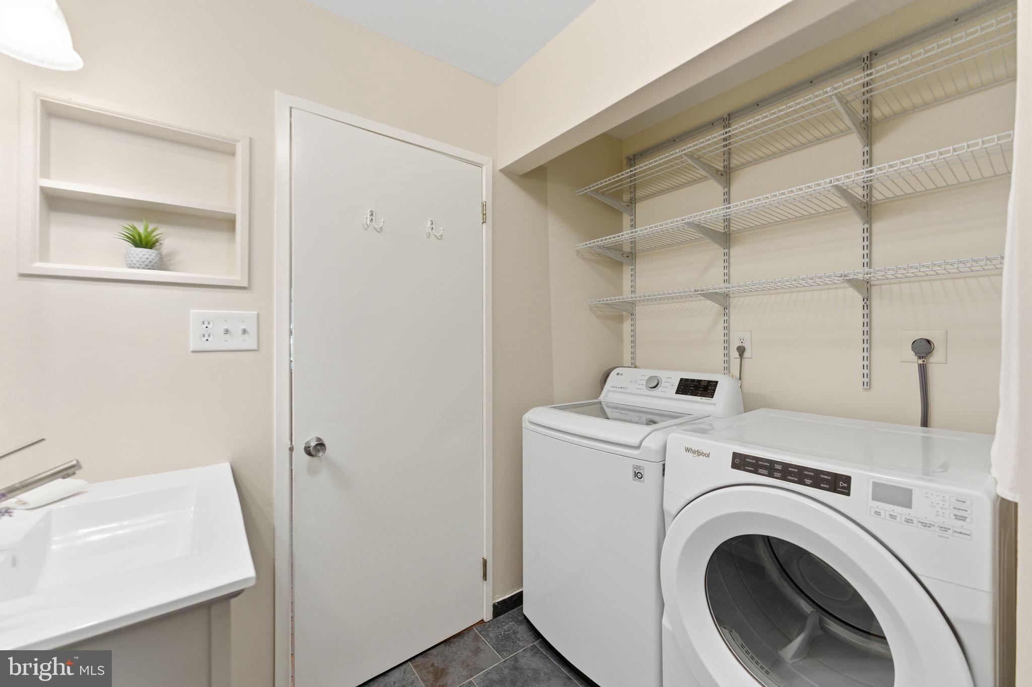 11309 Gatesborough Lane Reston, VA 20191 - Photo 36 of 85 a utility room with dryer and washer