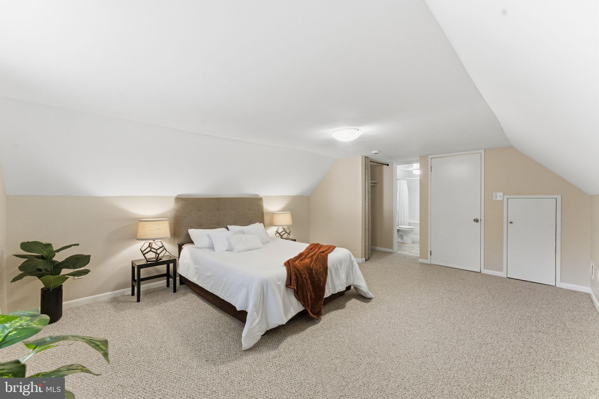 11309 Gatesborough Lane Reston, VA 20191 - Photo 41 of 85 a bedroom with a bed and a lamp