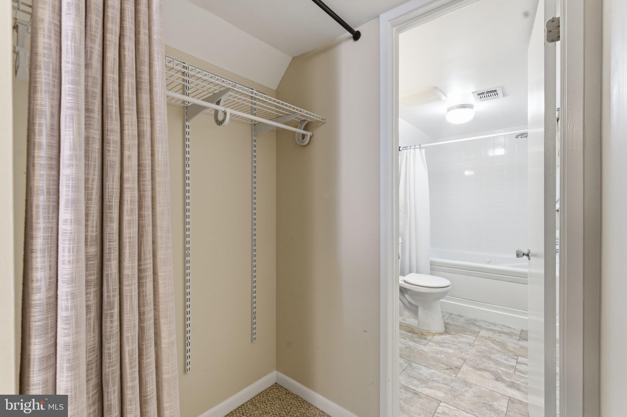 11309 Gatesborough Lane Reston, VA 20191 - Photo 43 of 85 a bathroom with a granite countertop shower and a toilet
