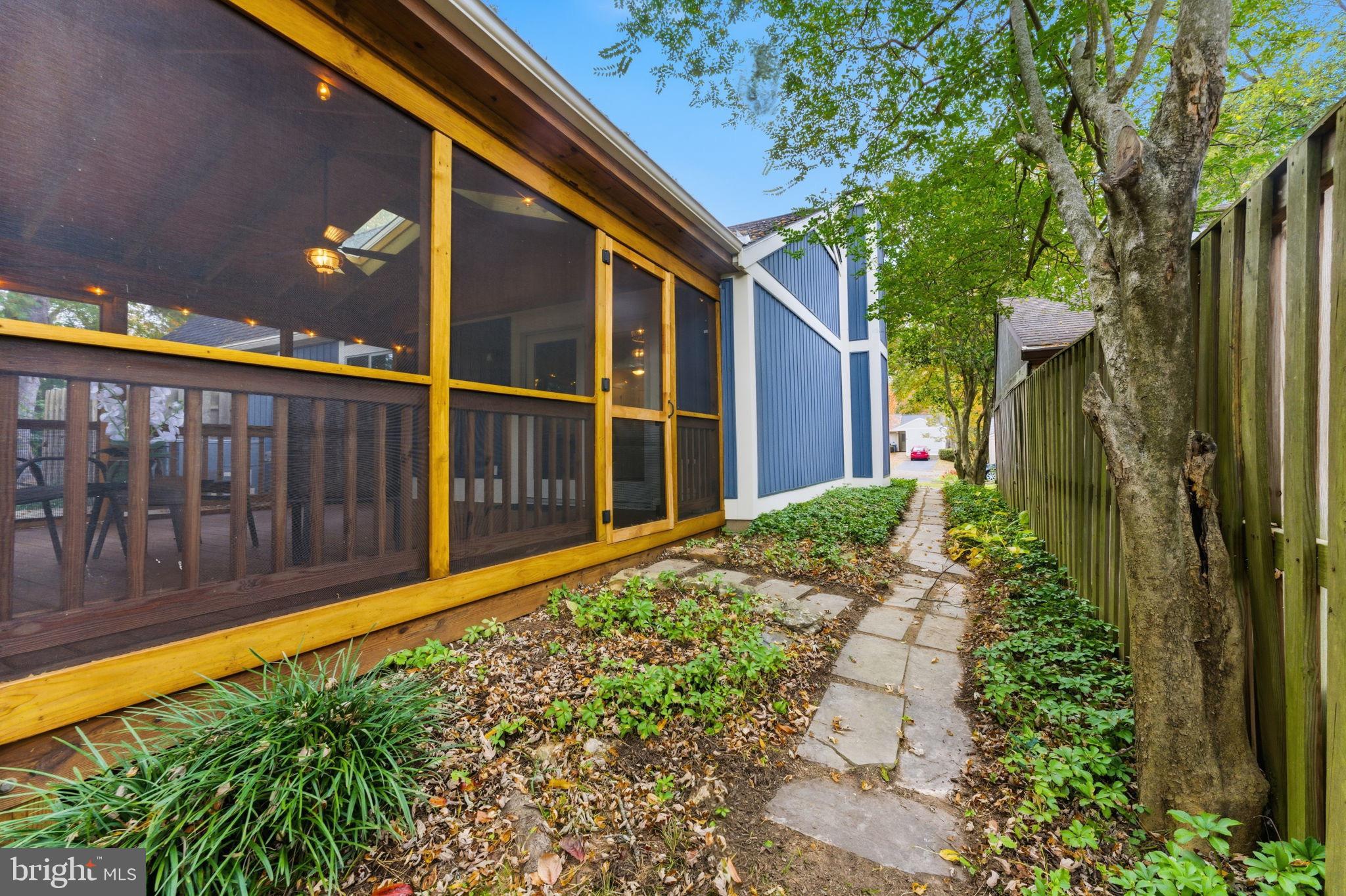11309 Gatesborough Lane Reston, VA 20191 - Photo 47 of 85 a view of a house with a large window and flower plants