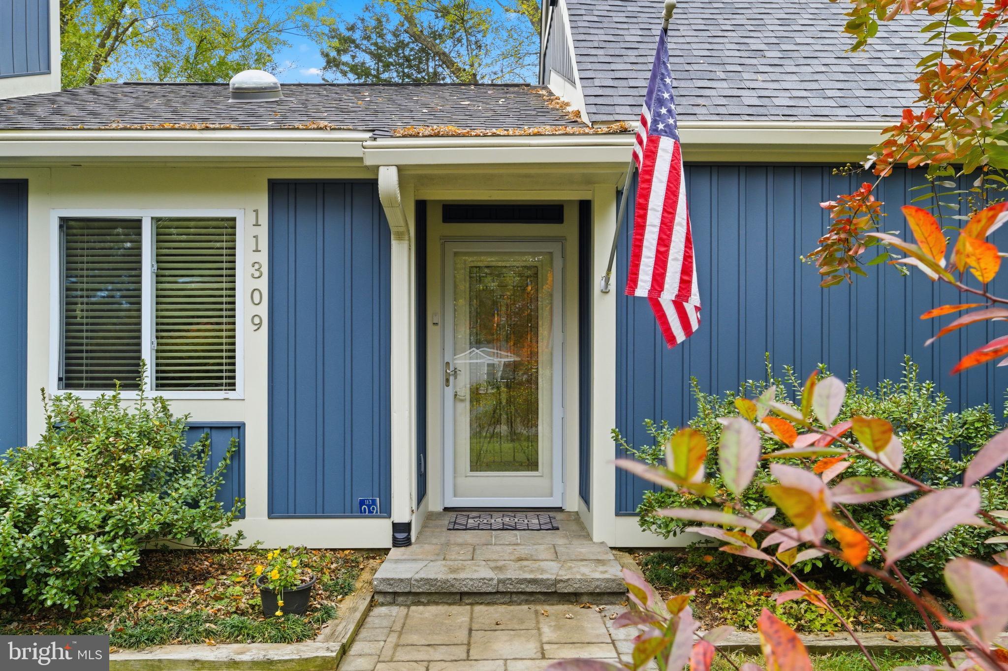 11309 Gatesborough Lane Reston, VA 20191 - Photo 5 of 85 a front view of a house with a garage