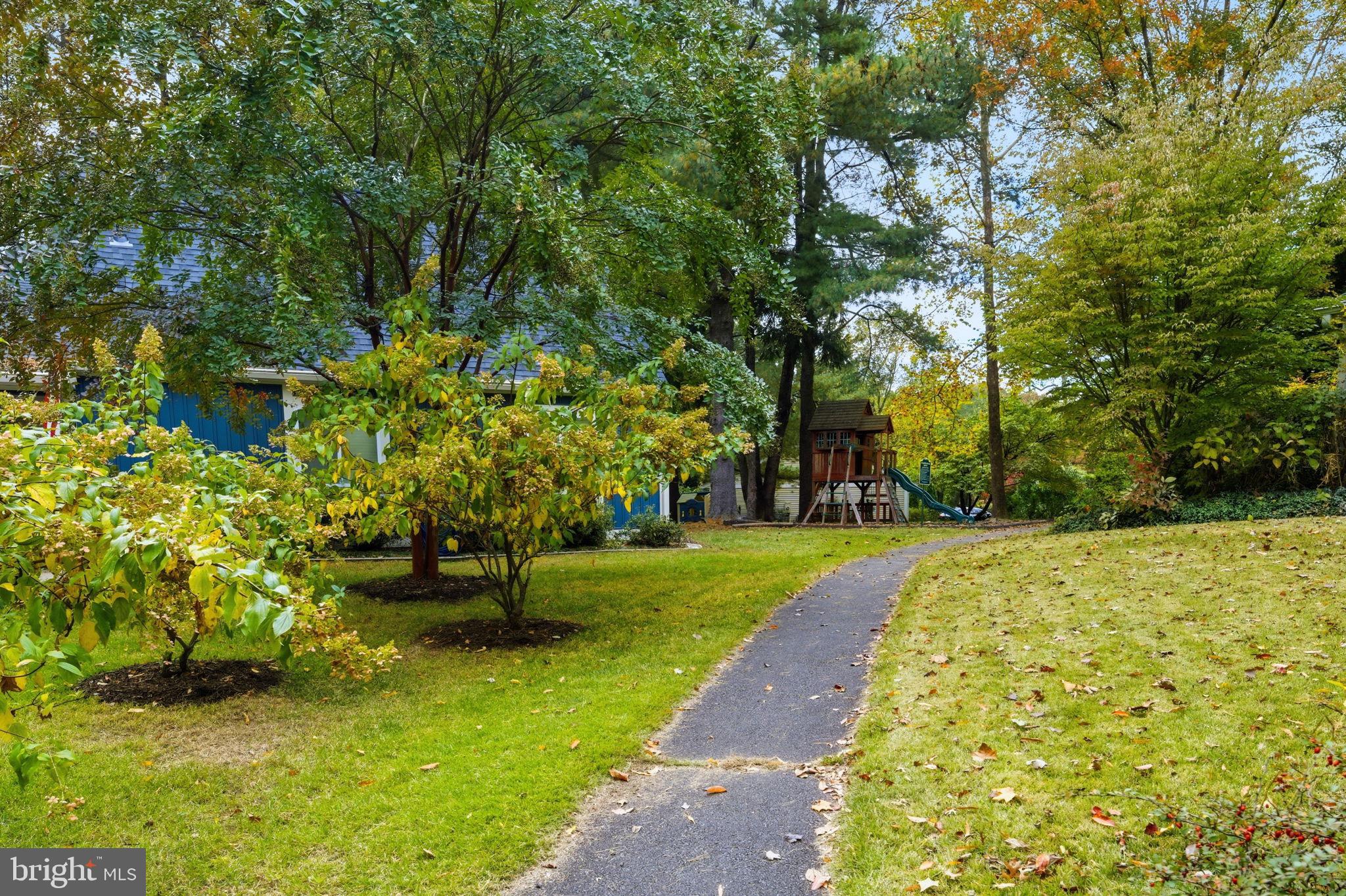 11309 Gatesborough Lane Reston, VA 20191 - Photo 56 of 85 Charming pathway through lush greenery.