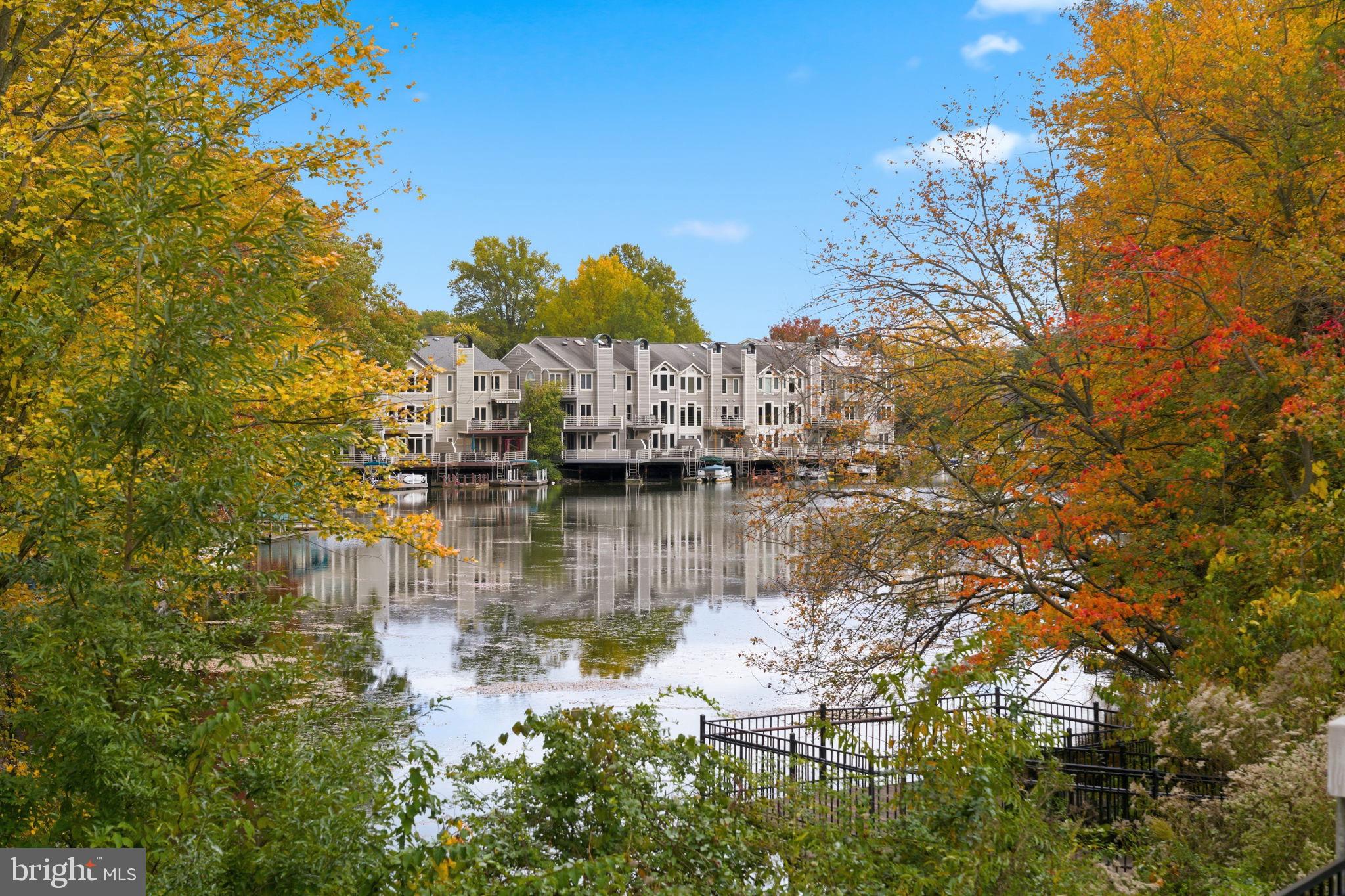11309 Gatesborough Lane Reston, VA 20191 - Photo 66 of 85 Serene lakeside living in vibrant autumn hues.