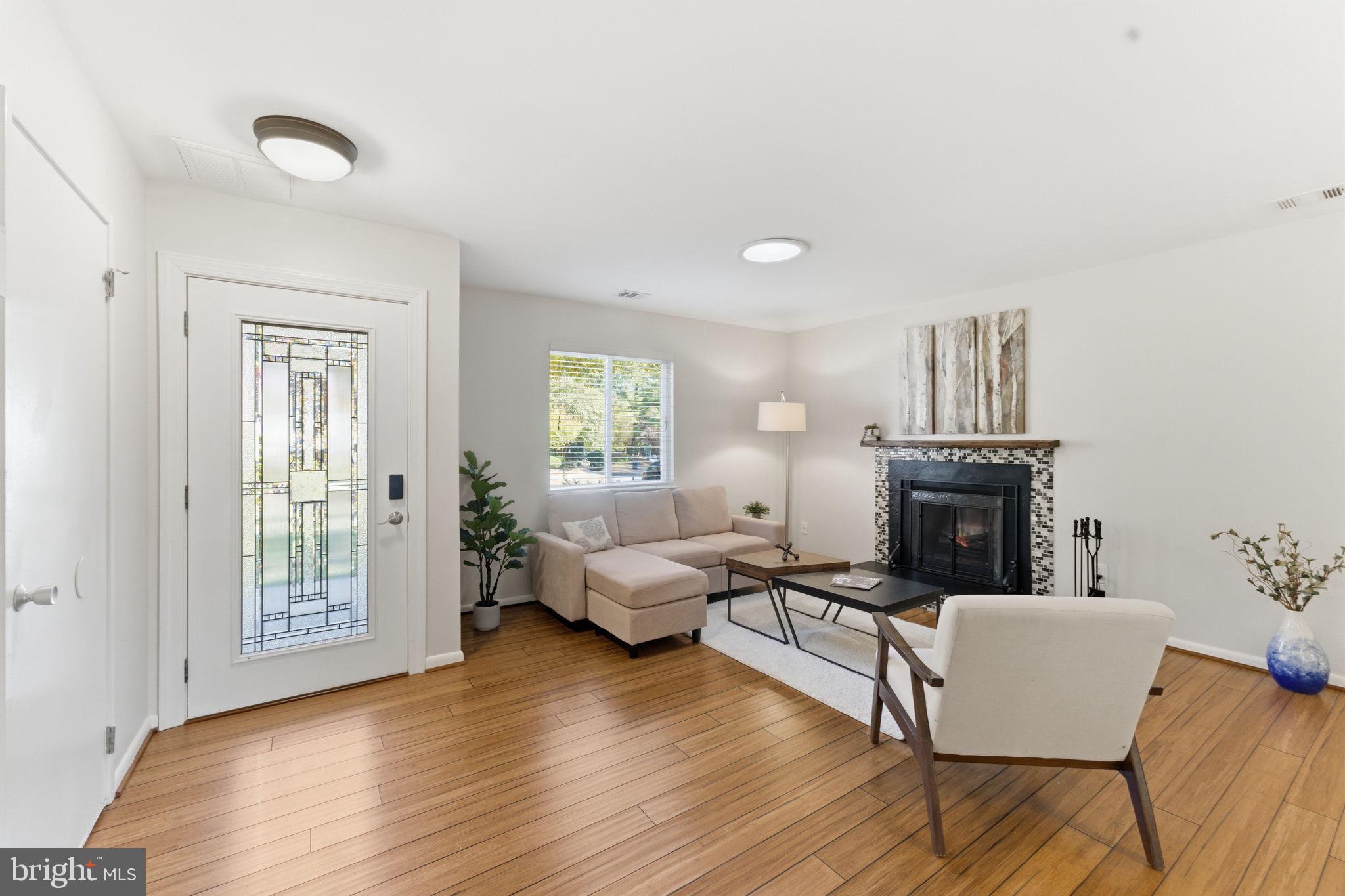 11309 Gatesborough Lane Reston, VA 20191 - Photo 7 of 85 a living room with furniture and a fireplace