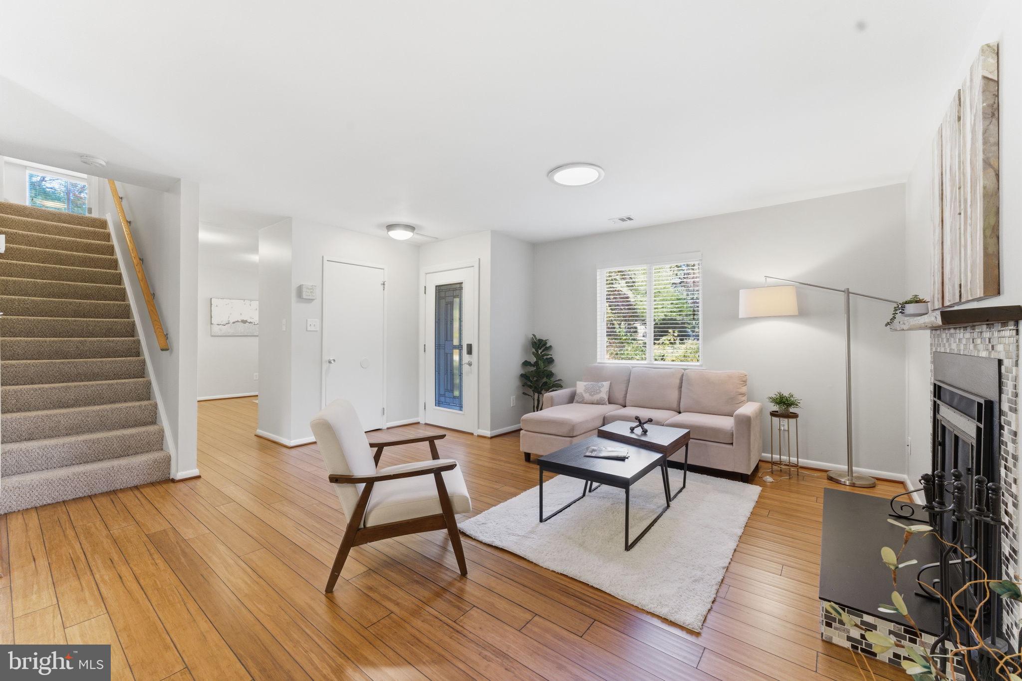 11309 Gatesborough Lane Reston, VA 20191 - Photo 10 of 85 a living room with furniture and a wooden floor