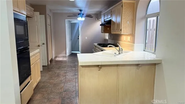 a bathroom with a sink a mirror and shower