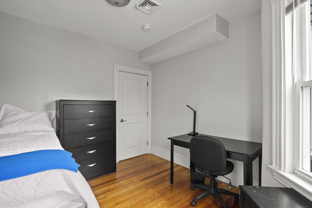 139 Adams Street, Unit 3 Waltham, MA 02453 - Photo 14 of 17 a workspace with furniture and window