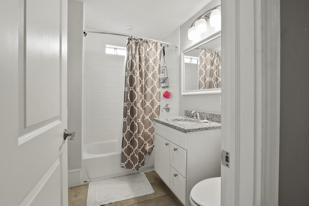 139 Adams Street, Unit 3 Waltham, MA 02453 - Photo 15 of 17 a bathroom with a sink toilet and shower