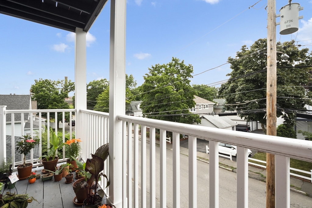 139 Adams Street, Unit 3 Waltham, MA 02453 - Photo 17 of 17 a view of a balcony with couch