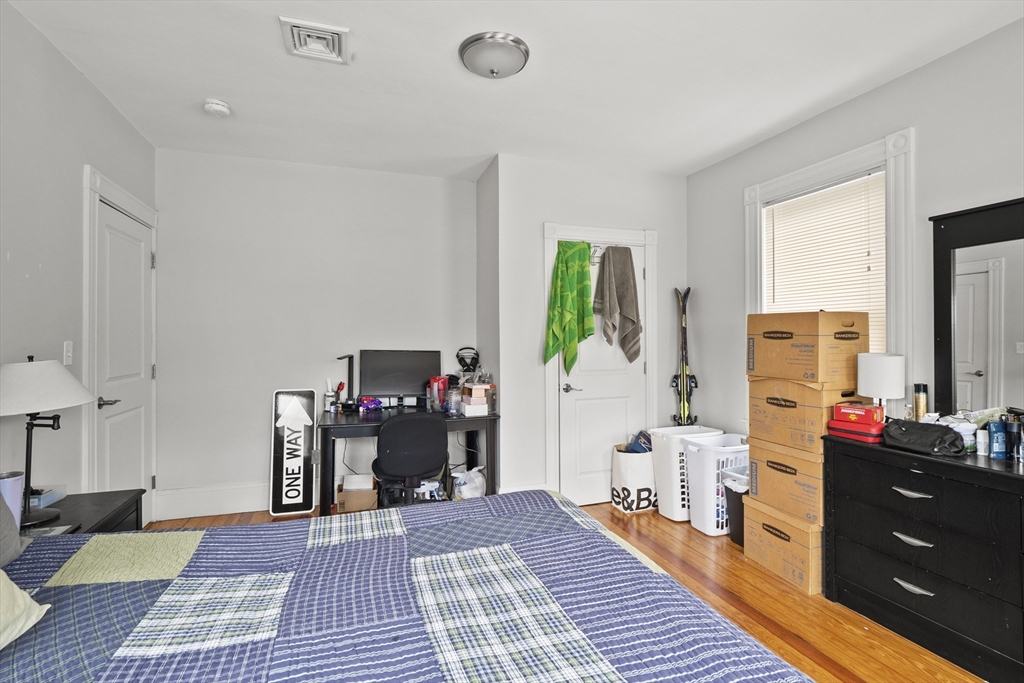 139 Adams Street, Unit 3 Waltham, MA 02453 - Photo 7 of 17 a living room with furniture and a fireplace