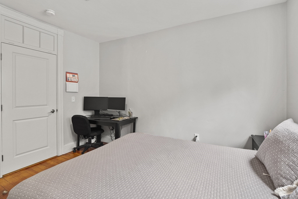 139 Adams Street, Unit 3 Waltham, MA 02453 - Photo 8 of 17 a workspace with a couch
