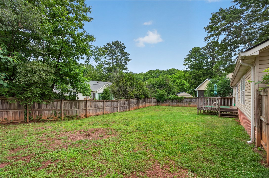 207 Hunters Lane Anderson, SC 29625 - Photo 4 of 46 A spacious backyard awaits, complete with a private deck ideal for relaxation and entertaining.