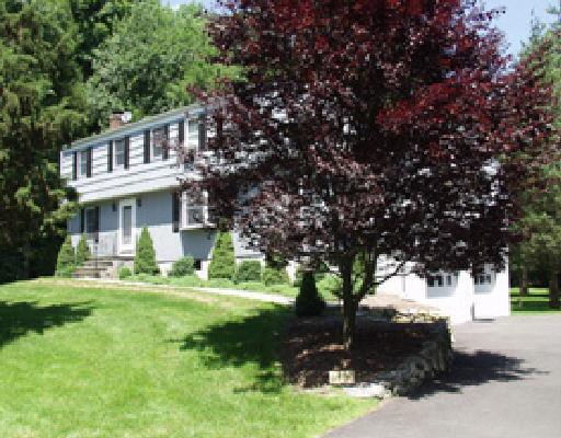 16 Granite Ridge Road Redding, CT 06896 - Photo 1 of 1 a view of a house with a yard