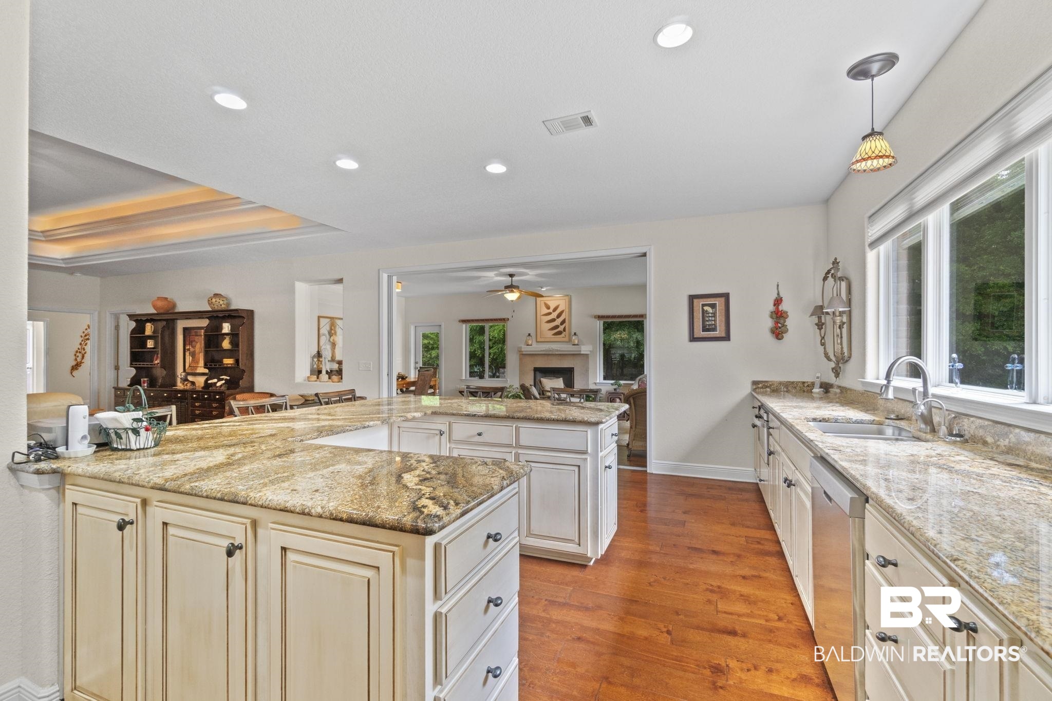 8664 Foxtail Loop Pensacola, FL 32526 - Photo 63 of 64 Kitchen featuring cream cabinets, dishwasher, a sink, a ceiling fan, and open floor plan