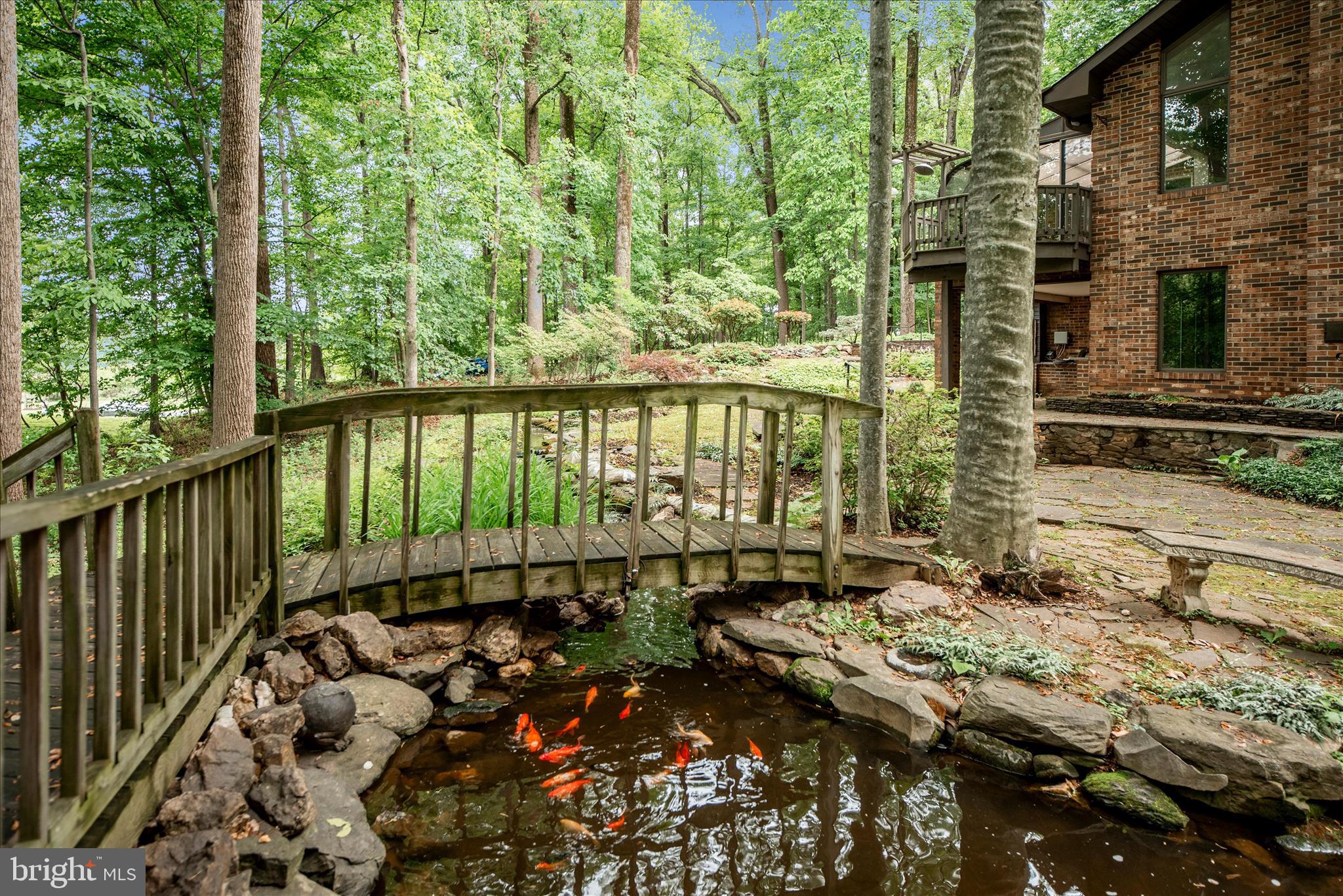 2221 Gold Mine Road Brookeville, MD 20833 - Photo 49 of 60 a view of a balcony with a lake view and wooden floor