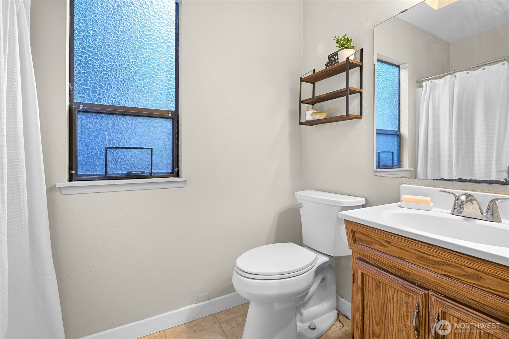 2550 Lake Whatcom Boulevard Bellingham, WA 98229 - Photo 16 of 38 a bathroom with a sink a toilet and shower