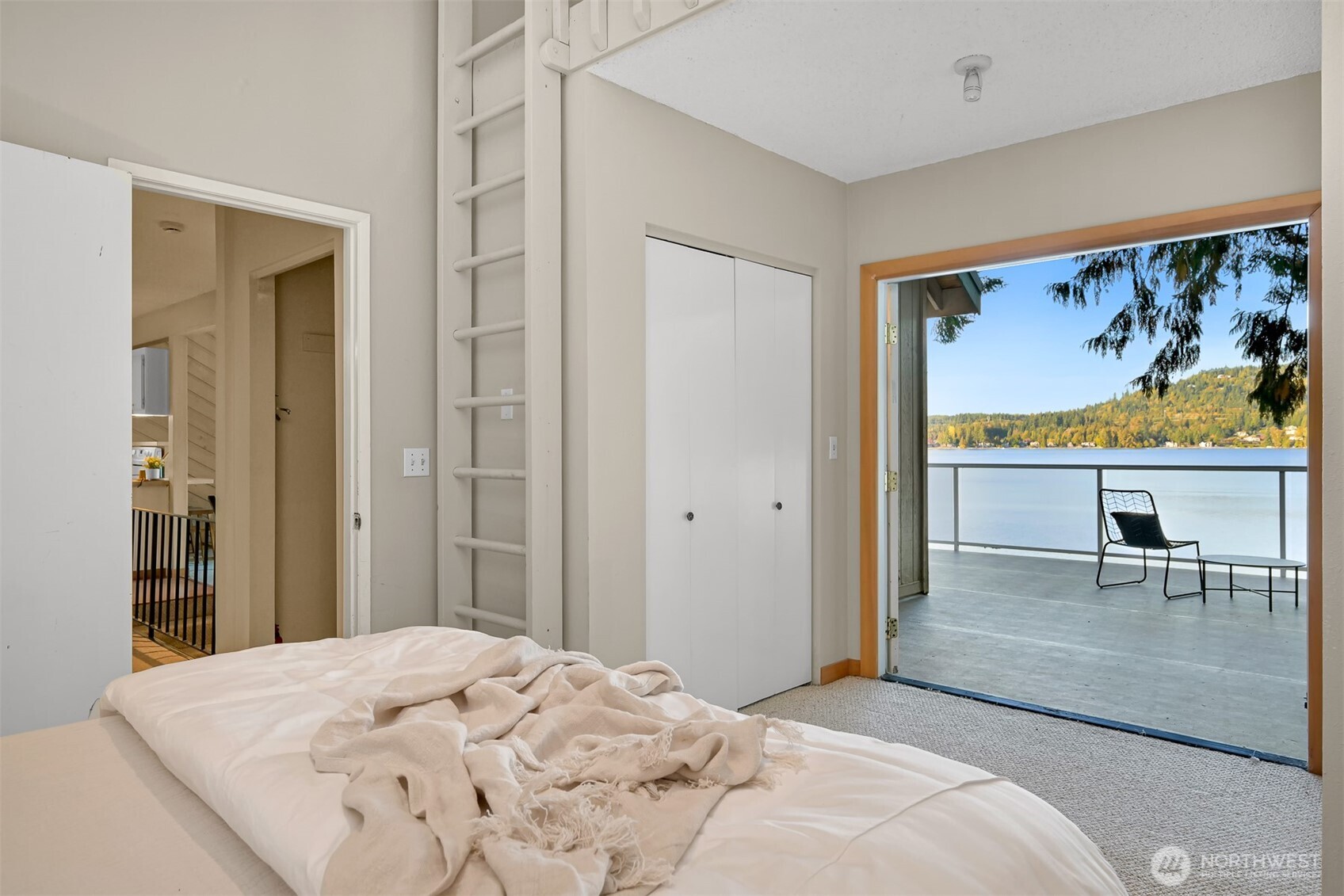 2550 Lake Whatcom Boulevard Bellingham, WA 98229 - Photo 18 of 38 a bedroom with a bed and glass window