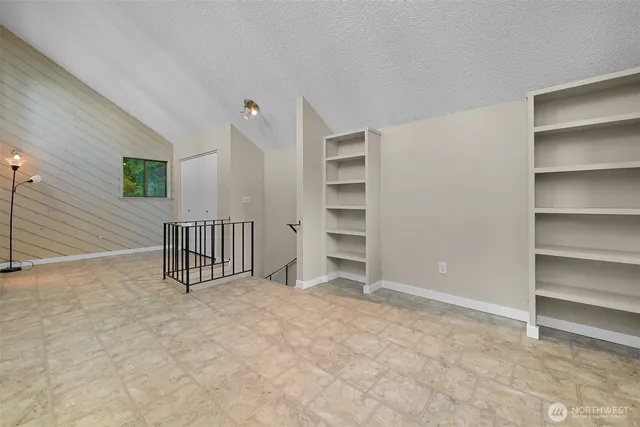 a bathroom with a sink mirror and toilet
