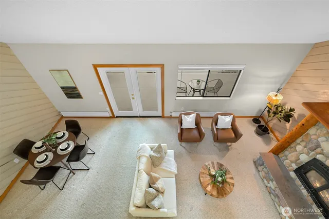 a view of a livingroom with wooden floor and a cabinet