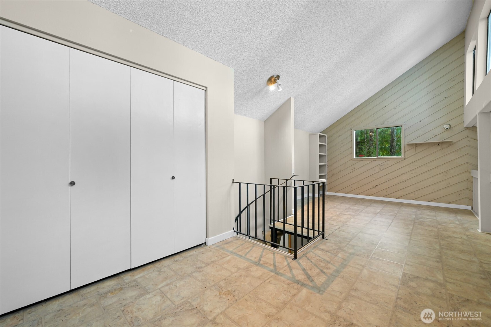 2550 Lake Whatcom Boulevard Bellingham, WA 98229 - Photo 24 of 38 a view of a livingroom with wooden floor and a cabinet