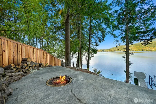 an outdoor space with pool and furniture