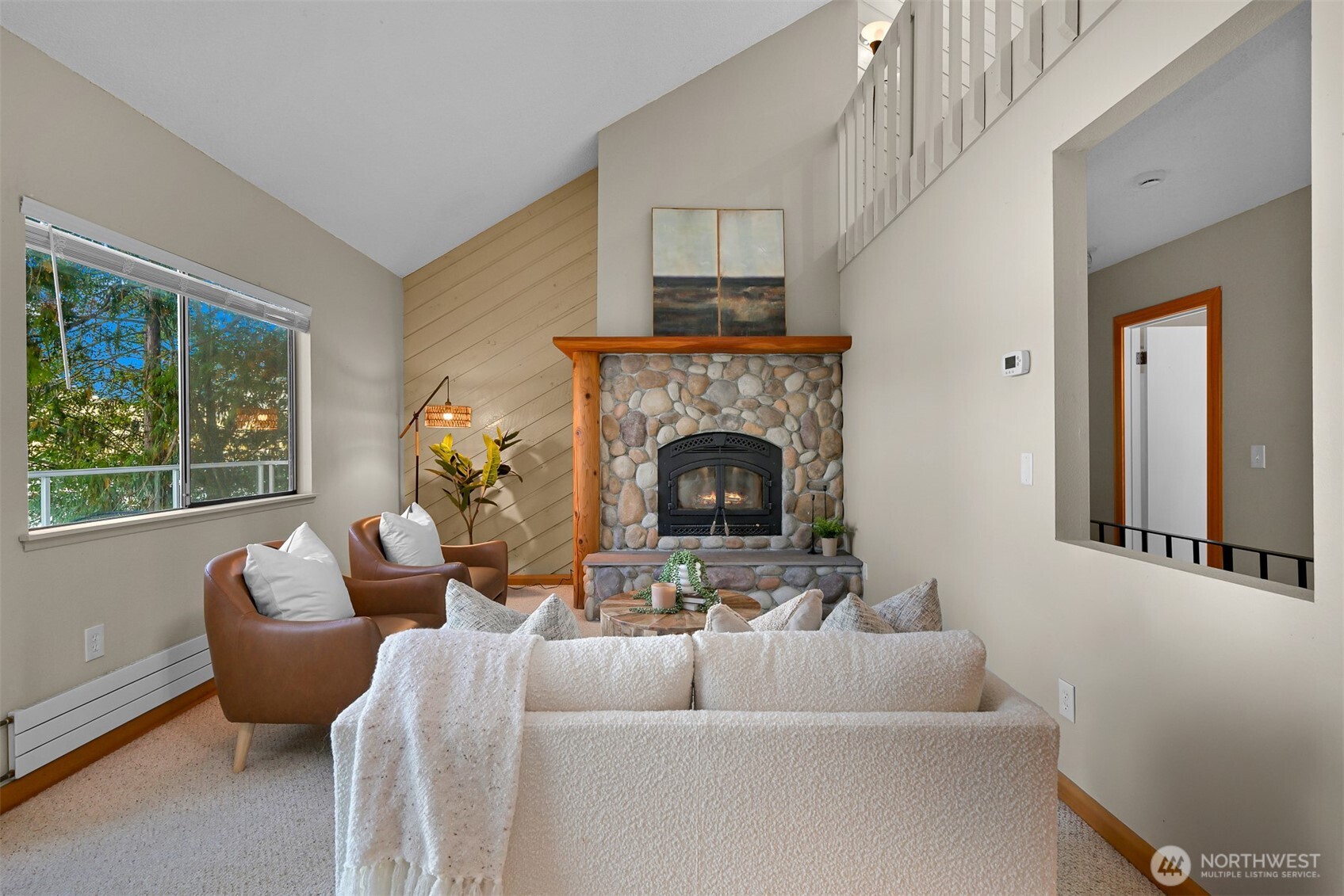2550 Lake Whatcom Boulevard Bellingham, WA 98229 - Photo 4 of 38 a living room with furniture and a fireplace