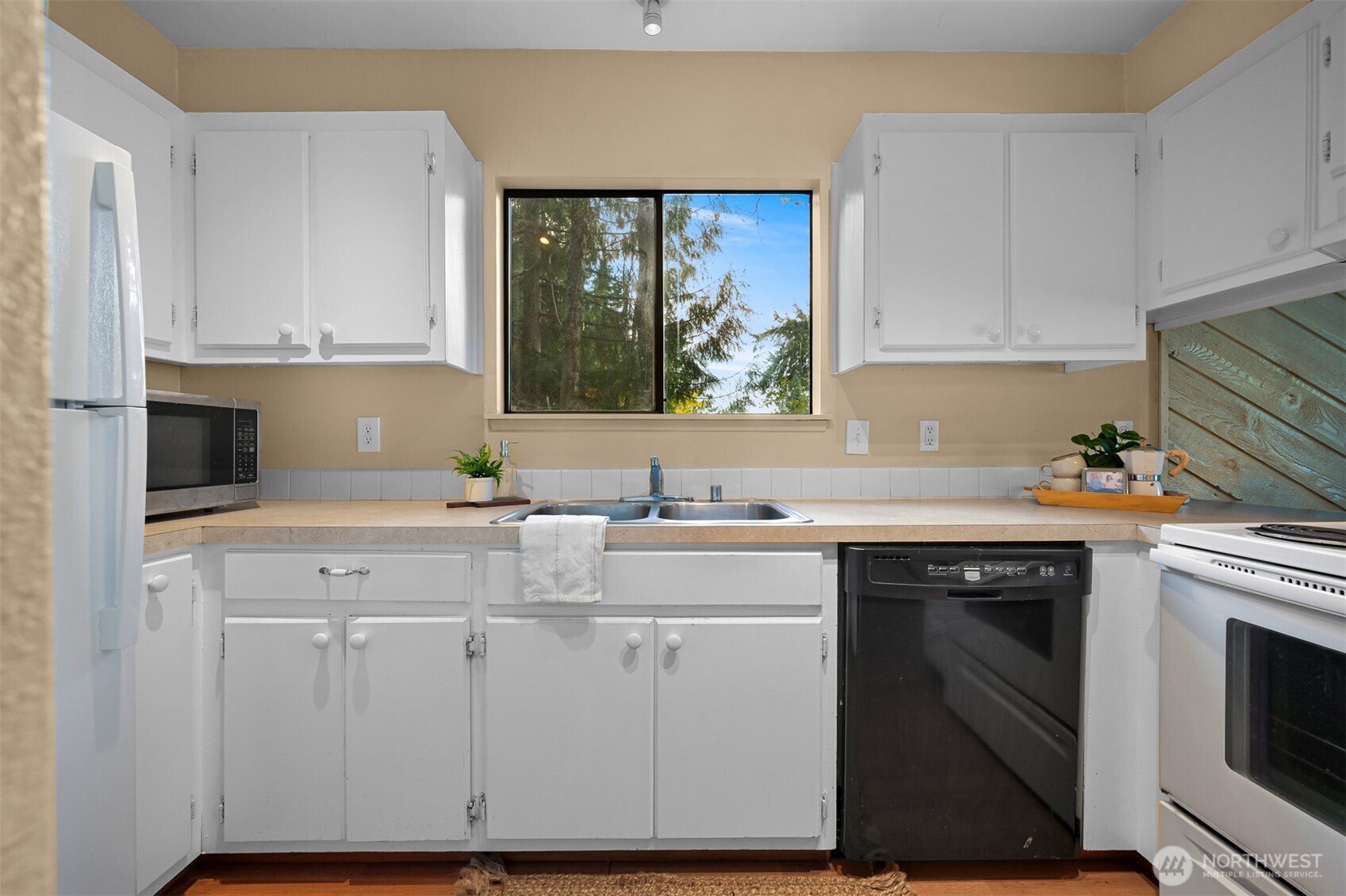 2550 Lake Whatcom Boulevard Bellingham, WA 98229 - Photo 8 of 38 a kitchen with white cabinets and white appliances