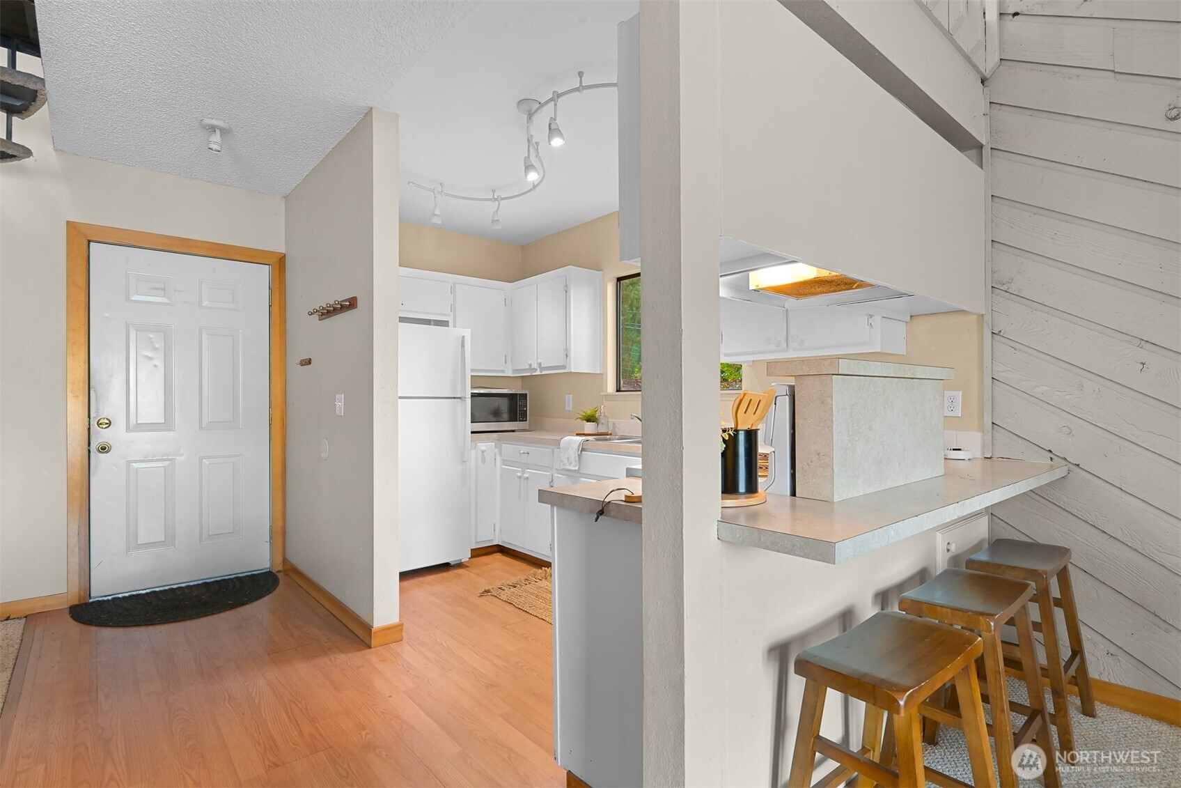 2550 Lake Whatcom Boulevard Bellingham, WA 98229 - Photo 10 of 38 a view of a kitchen with furniture and wooden floor