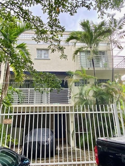 3099 Oak Avenue, Unit 1 Miami, FL 33133 - Photo 1 of 2 a view of a balcony with a tree