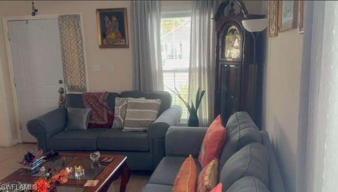 199 Leawood Circle Naples, FL 34104 - Photo 6 of 21 a living room with furniture and a window