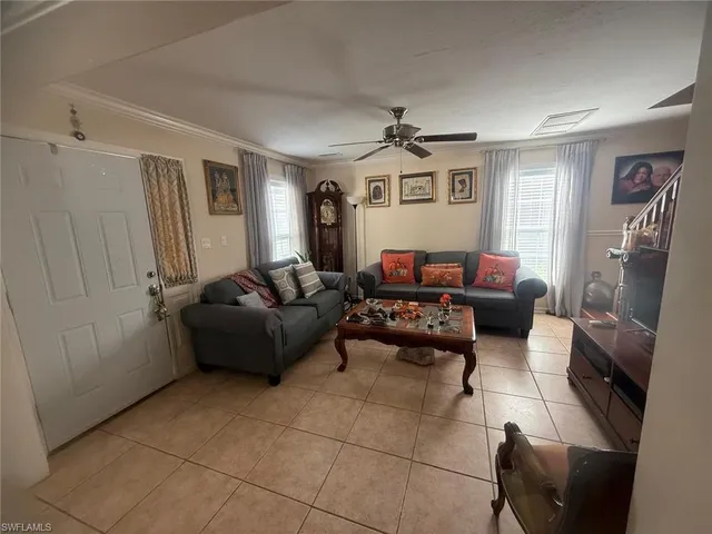 a living room with furniture and a window