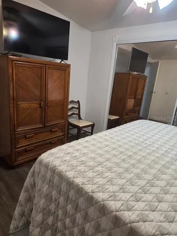 a bedroom with a bed and a walk in closet