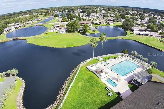 an aerial view of a pool patio swimming pool and outdoor seating