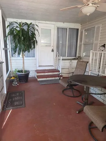 a room with gym equipment and floor to ceiling window