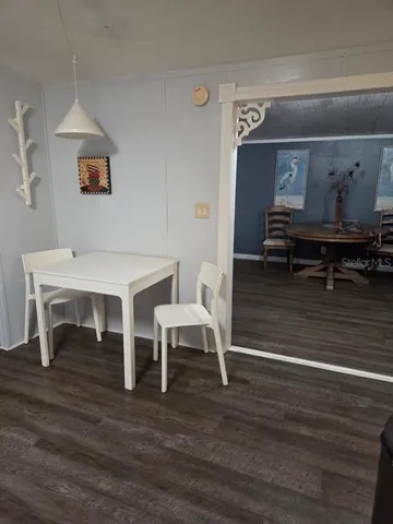 a view of livingroom with furniture wooden floor and table