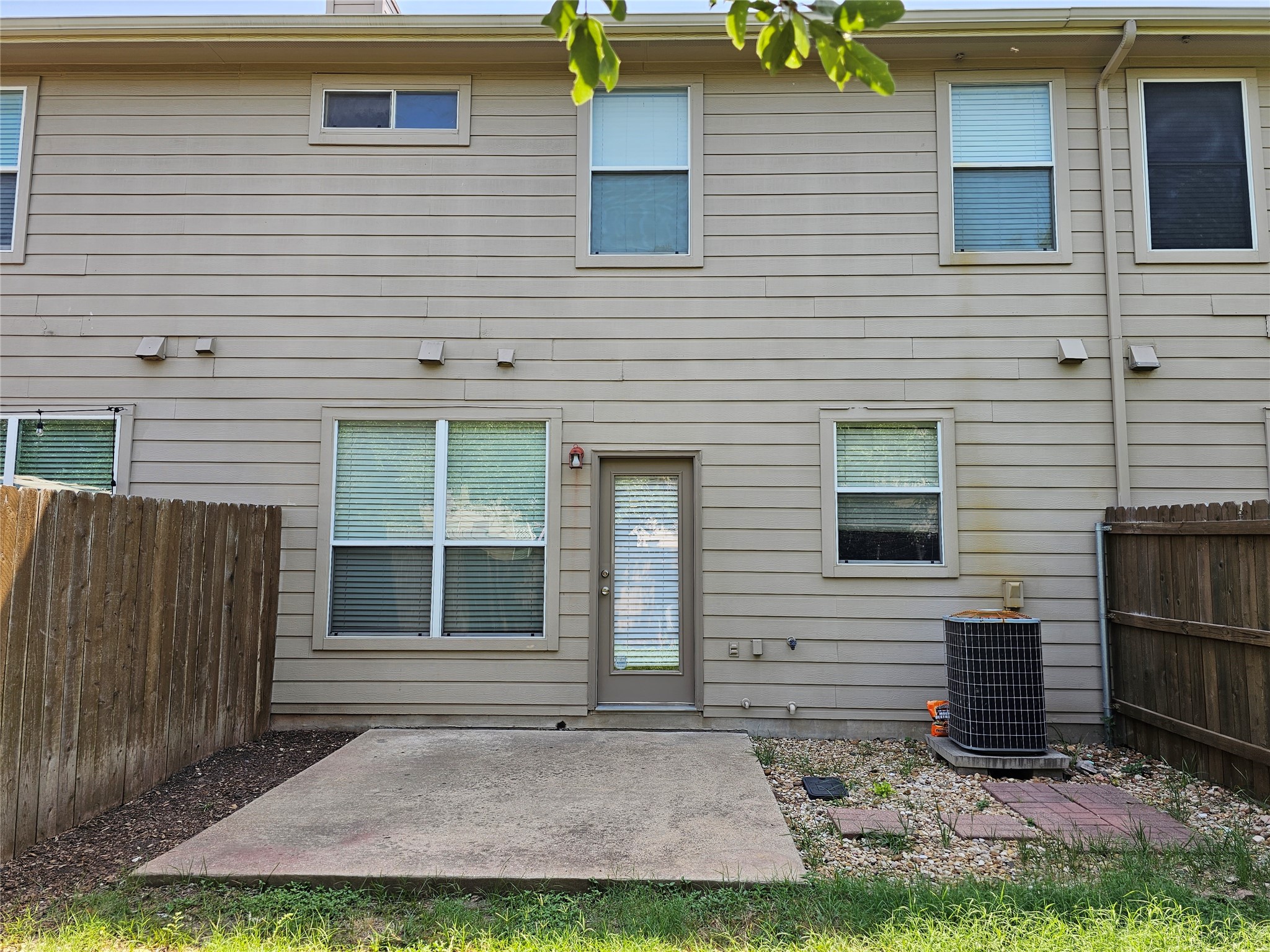 78 Verde Ranch Loop Leander, TX 78641 - Photo 20 of 23 A well-maintained rear exterior featuring a concrete patio and durable siding.