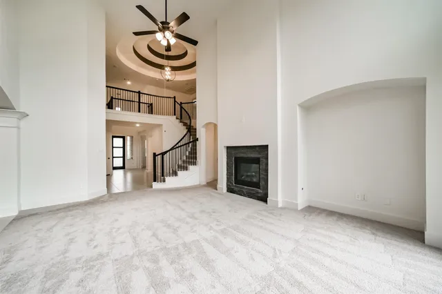 a view of an empty room with a fireplace