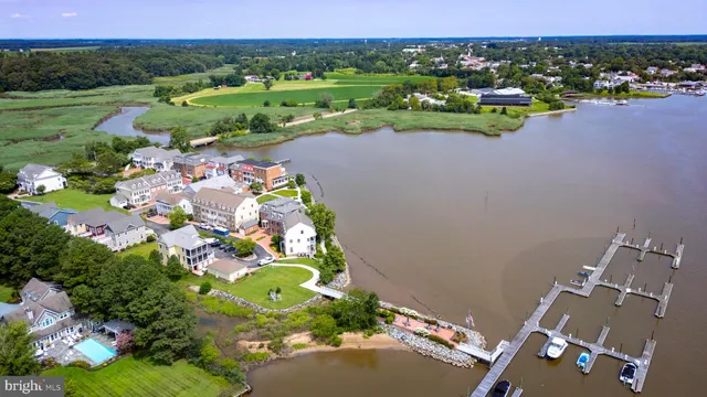 an aerial view of a house with a garden and swimming pool