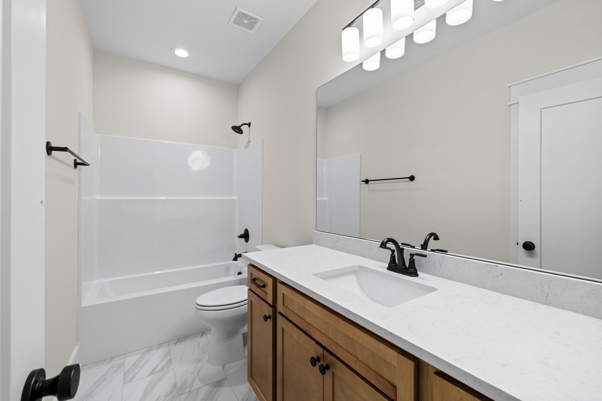 2039 Grace Johns Circle Murfreesboro, TN 37128 - Photo 22 of 33 a bathroom with a sink a toilet and shower